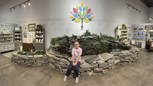 Mark-It Gifts photo of little girl on fountain at Fort Wayne Painted Tree location